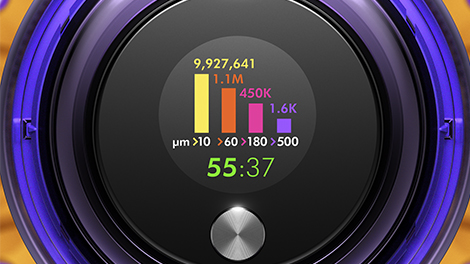 The LCD screen reporting on the amount and size of dirt particles drawn up in real time.